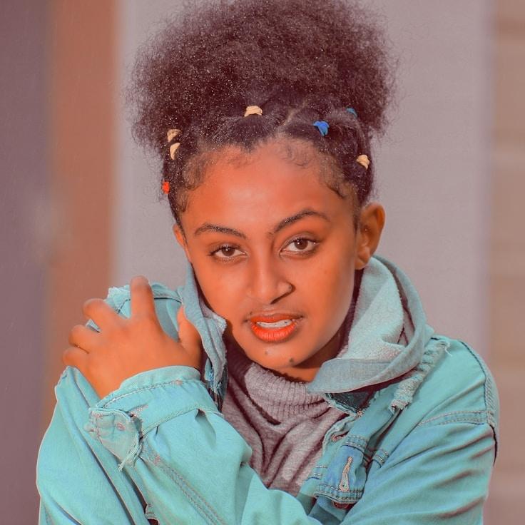 Avery Chen, Lead Design Curator at BalancedMindFlow, reviewing corporate floral arrangements